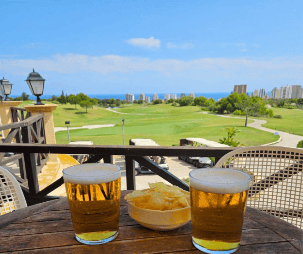 beers and snacks on the terrace at the Melia Villaitana Golf Club in Benidorm Overlooking the golf course and the Med' Sea